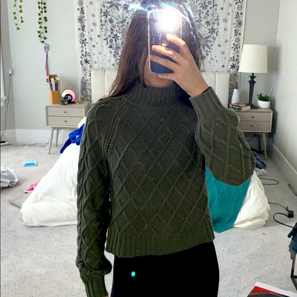 Green turtleneck sweater